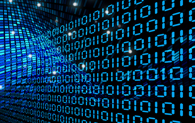 PCモニターに表示される無数のブルーライトに光る数字データの画像