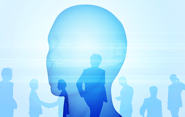 人間の頭部とビジネスピープルのブルーな透過状のシルエットパターンの画像
